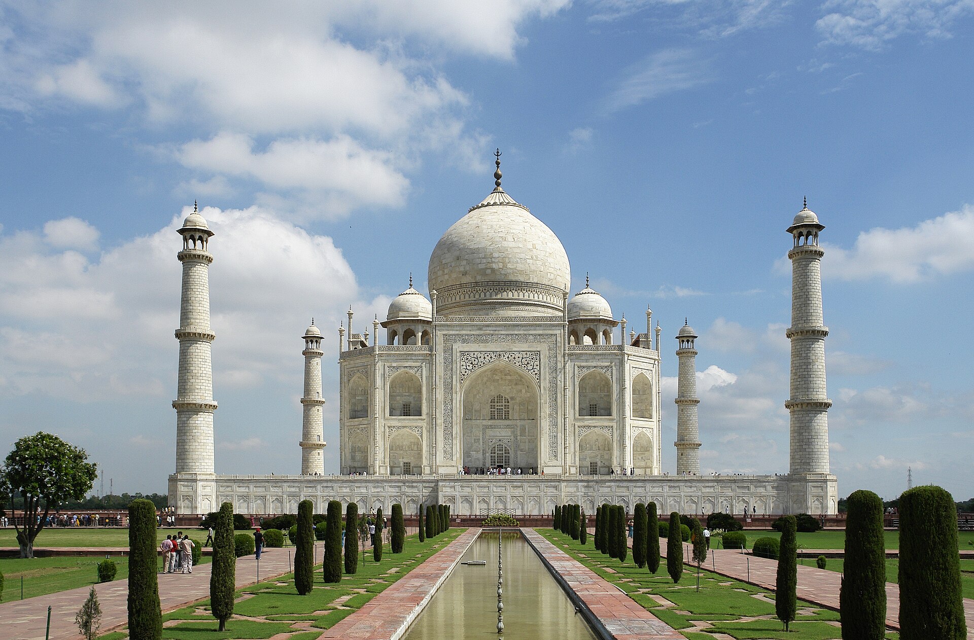 Iconic Taj Mahal at sunrise with reflection pool in Agra